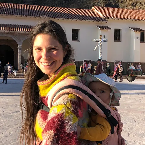 Headshot of Cynthia Ingar with baby in carrier on her back