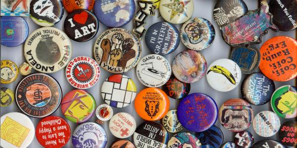 Collection of buttons in varying sizes and sentiments