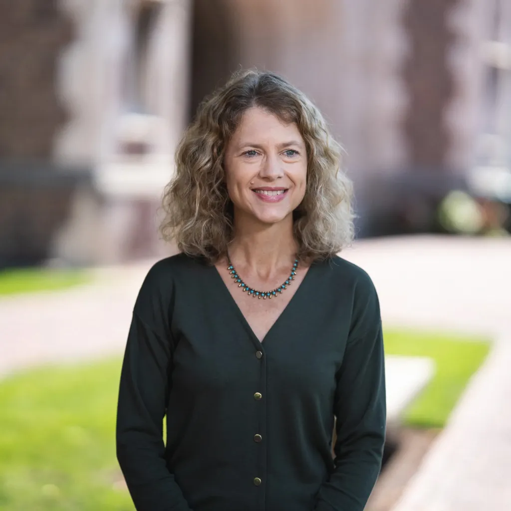 "photo of a woman in a dark shirt"