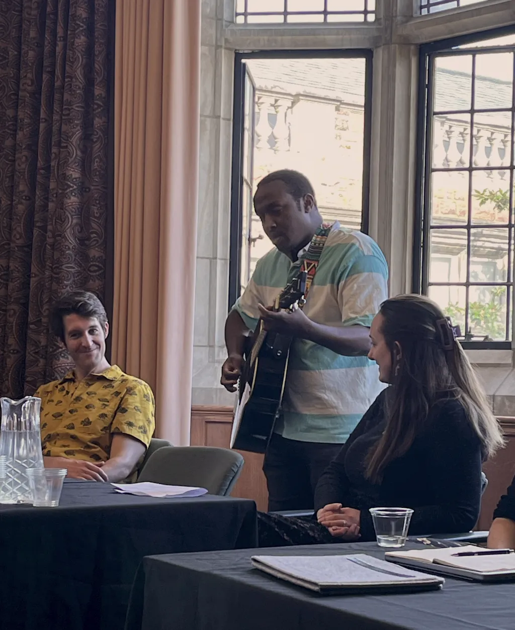 G’Ra Asim, Assistant Professor of English, plays guitar and sings