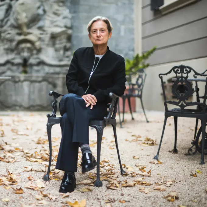 "photo of a person sitting on a chair outdoors"