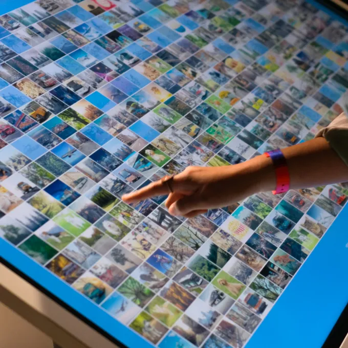 Photo of a person interacting with a touchscreen display